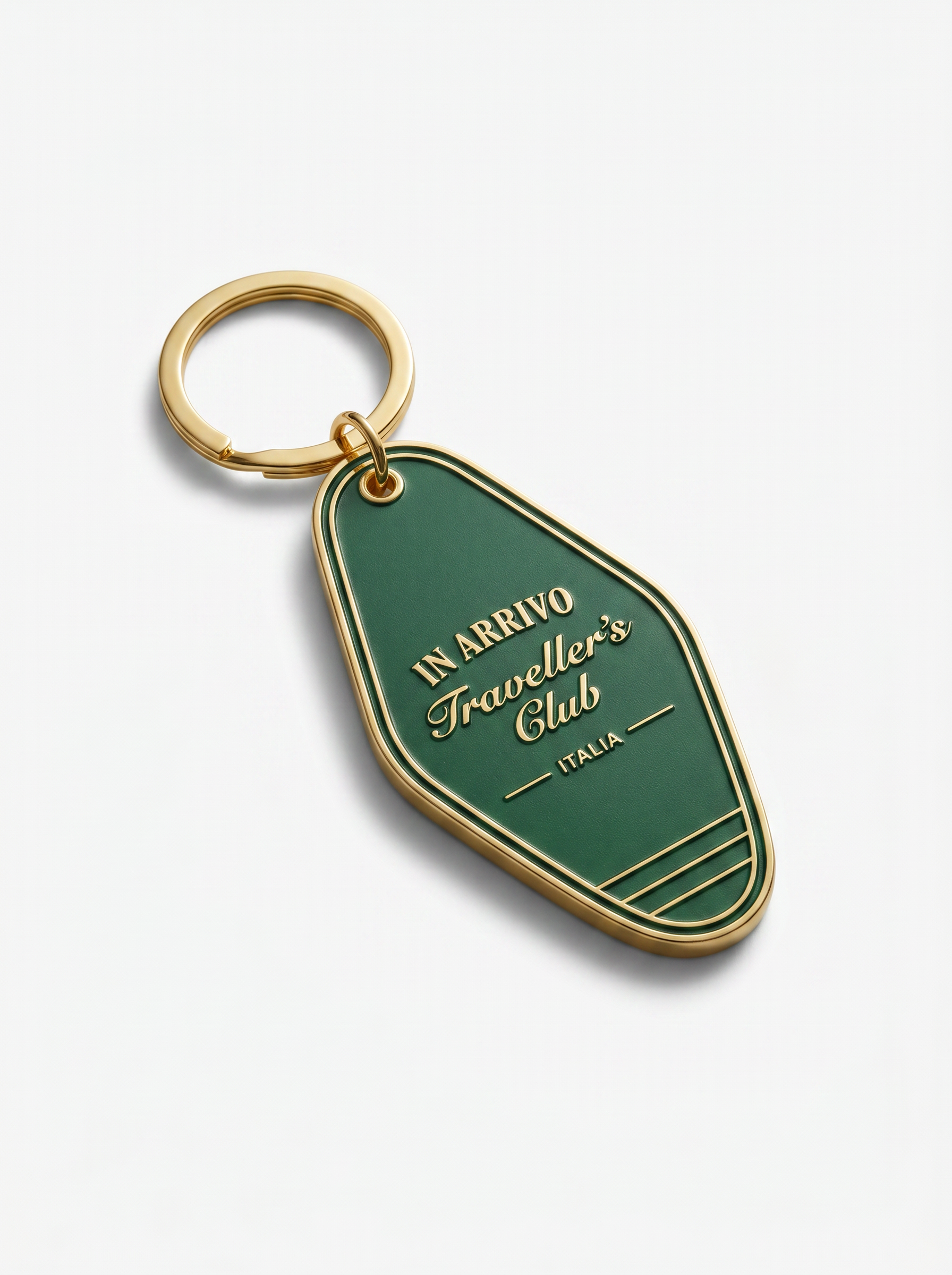 Green keychain with gold ring on a white background